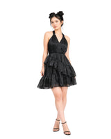 Black satin halter mini dress with layered organza ruffles and tiered silhouette